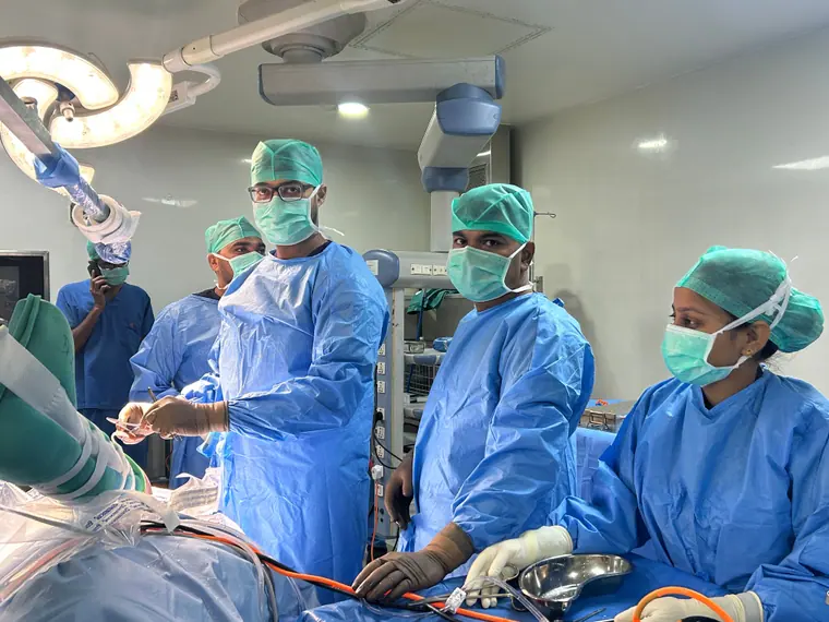 Dr. Mandar Deb operating in a modern operating theatre